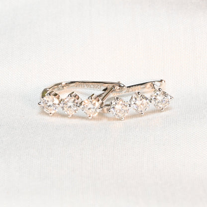 Pure Brilliance · 3-Stone Moissanite Dangle Earrings · Sterling Silver