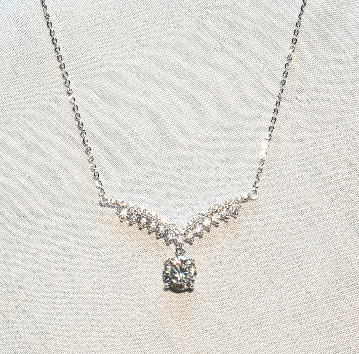 Pure Brilliance · V Swing Moissanite Pendant Necklace · Sterling Silver